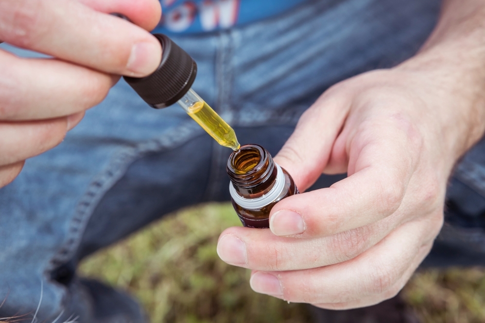 Taking Drops of CBD Oil